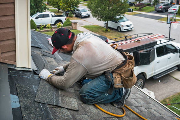 Professional Storm Damage Roof Repair technician working in Iola, WI